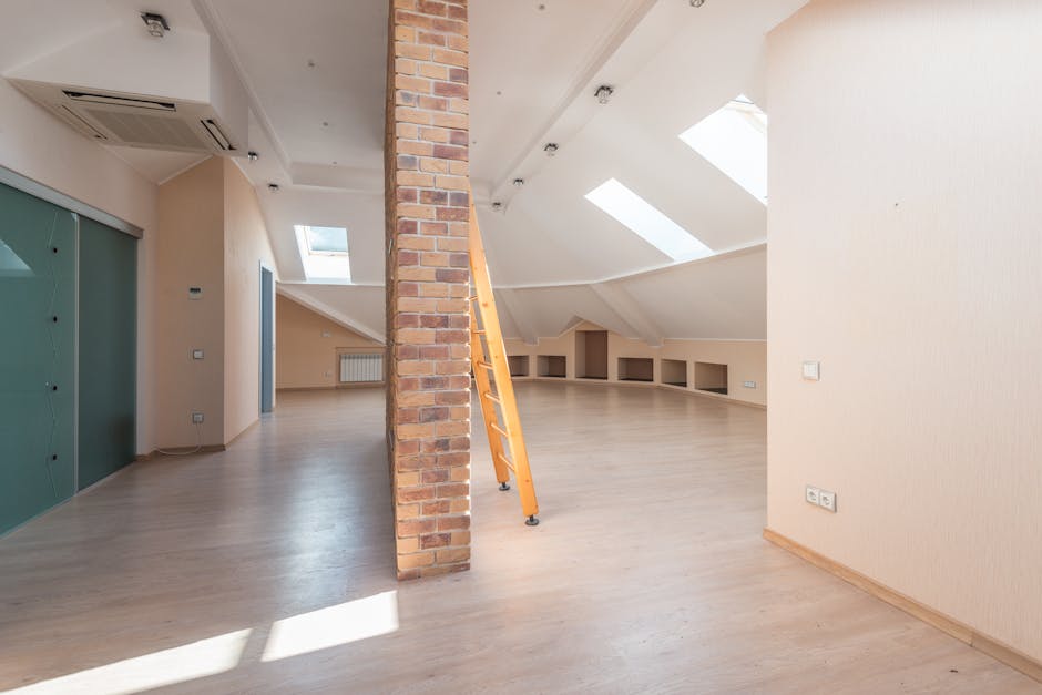 Professional applying spray foam insulation in an attic